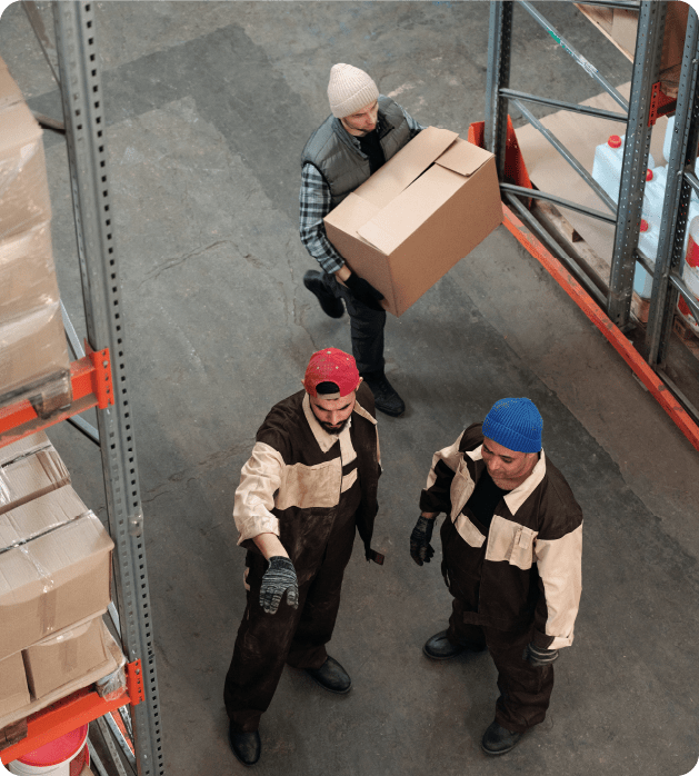 Workers in a warehouse as they delegate.