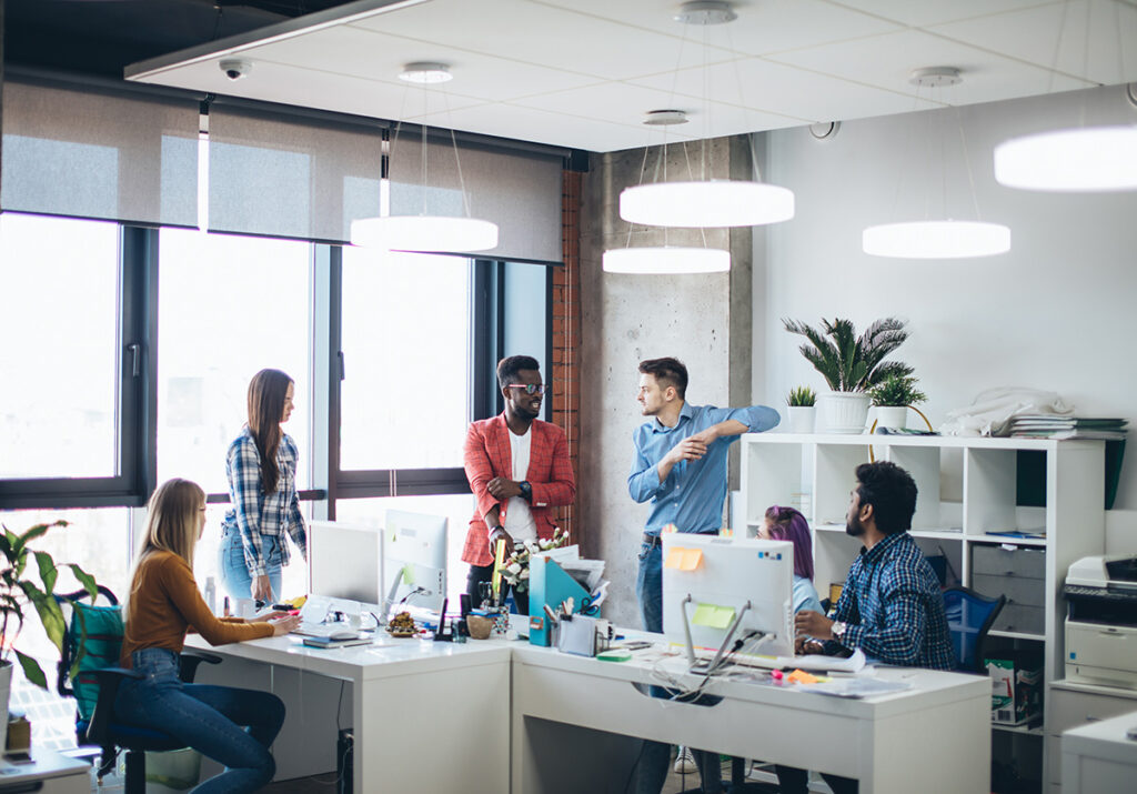 Indoor shot of loft modern business office interior with working staff.